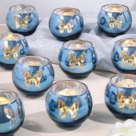 PRICES MAY VARY. ❤️Blue Votive Candle Holders: The blue candle holder is brightly colored and has a unique and elegant design. When lit, it projects a beautiful butterfly light, giving you a dreamy and enchanting atmosphere. You deserve it. ❤️Perfect Blue Candleholders Decoration：Use this blue candle holder at your wedding or dining table, with beautiful butterflies dancing, creating a romantic and unique atmosphere for you. It is especially suitable for summer seaside weddings and various celeb Purple Butterfly Centerpieces Quinceanera, Blue Butterfly Decor, Blue Butterfly Decorations For Party, Baby Blue Party Decorations, Blue Sweet 16 Decorations, Blue Butterfly Quinceanera Theme, Light Blue Quinceanera Ideas, Bud Vases For Wedding, Boys Birthday Theme