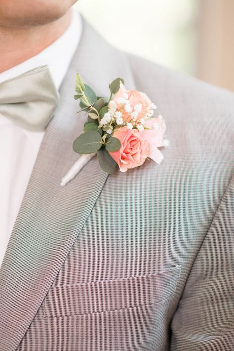 Pink Roses and Baby's Breath Boutonniere | Audrey Rose Photography https://www.theknot.com/marketplace/audrey-rose-photography-norfolk-va-766665 | Morrison's Flowers & Gifts https://www.theknot.com/marketplace/morrisons-flowers-and-gifts-williamsburg-va-512136 Peach And White Boutonniere, Peach Boutonniere Wedding, Suit With Peach Tie, Peach Buttonhole, Peach Groomsmen, Peach Boutonniere, Apricot Wedding, Wearable Flowers, Pantone 2024