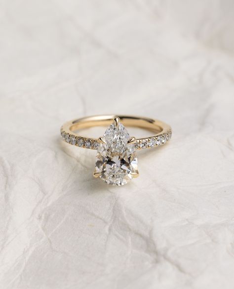 The PEAR-fect way to start your ring stack... with the Jordanna Pear Solitaire🤍⁠ ⁠ A pear-shaped diamond, also known as a teardrop diamond, combines the characteristics of a round and a marquise cut to create a unique and elegant gemstone shape with a single point and a rounded end✨💍⁠ ⁠ ⁠ Details:⁠ Jordanna Pear Solitaire⁠ with Pave & Hidden Halo 2.52ct | F | VS1 ⁠ Gold Engagement Rings Teardrop, Pear Cut Gold Engagement Ring, Engagement Rings Teardrop, Rings Teardrop, Gold Oval Engagement Ring, Teardrop Diamond, Halo 2, Timeless Engagement Ring, Pear Ring