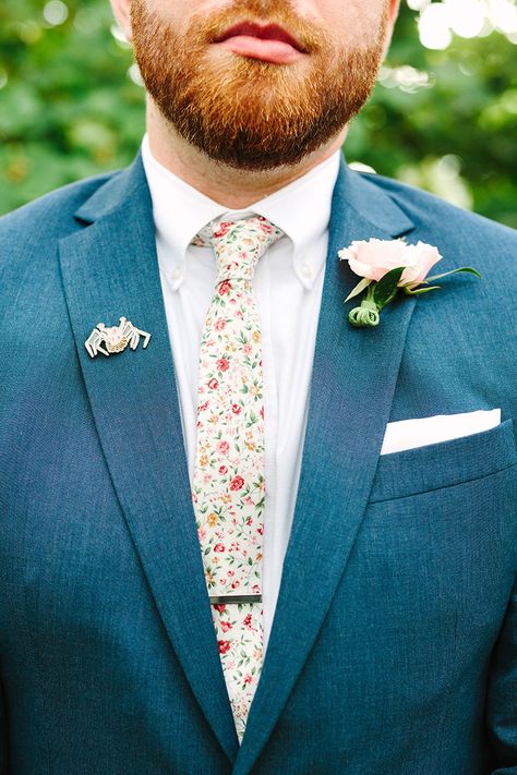 Navy Suit With Floral Tie, Floral Tie Wedding Groomsmen, Groom Suit Garden Wedding, Groom Suit Spring Wedding, Groom Garden Wedding Outfit, Floral Groomsmen Attire, Wildflower Wedding Groom, Pastel Wedding Groomsmen, Garden Wedding Groom Attire