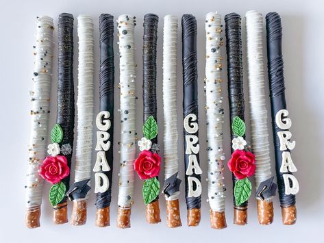 Graduation Pretzels 🎓🌹🩶 #chocolatecoveredpretzels #pretzels #chocolatepretzels #graduationtreats #graduation #graduationtreats🎓 #treatmaker Graduation Pretzel Rods, Graduation Pretzels, Dipped Desserts, Chocolate Dipped Pretzel Rods, Dipped Pretzel Rods, Graduation Treats, Graduation Desserts, Chocolate Dipped Pretzels, Grad Party Decorations