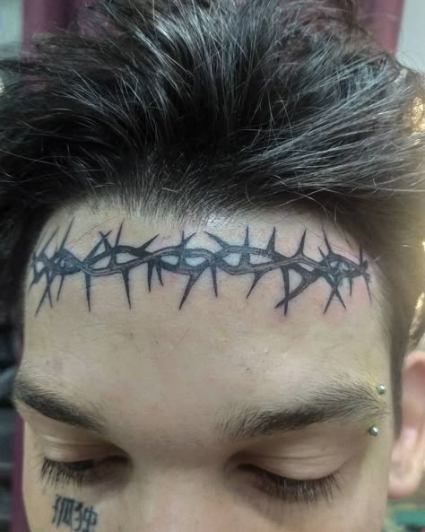 Crazy Face Tattoos, Face Tattoos Words, Barbed Wire Forehead Tattoo, Forehead Tattoo Ideas, Barbed Wire Face Tattoo, Forehead Hairline Tattoo, Hairline Tattoo For Women Forehead, Spiderweb Face Tattoo, Goth Face Tattoo