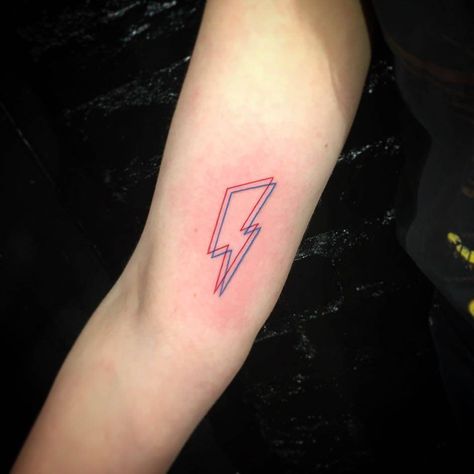 David Bowie's bolt anaglyph tattoo on the right inner arm. Blitz Tattoo, David Bowie Tattoo, Lightning Bolt Tattoo, Small Wave Tattoo, 42 Tattoo, Lightning Tattoo, Bolt Tattoo, 4 Tattoo, Waves Tattoo