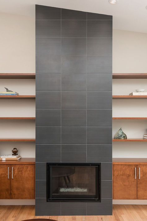 Black Porcelain Tile Fireplace With Wood Shelves And Cabinets Wood Stoves Ideas Living Rooms, Wood Stoves Ideas, Herringbone Tile Fireplace, Tiled Fireplace Wall, Chic Fireplace, Fireplace Tile Ideas, Black Brick Fireplace, Beige Marble Tile, Black Porcelain Tiles