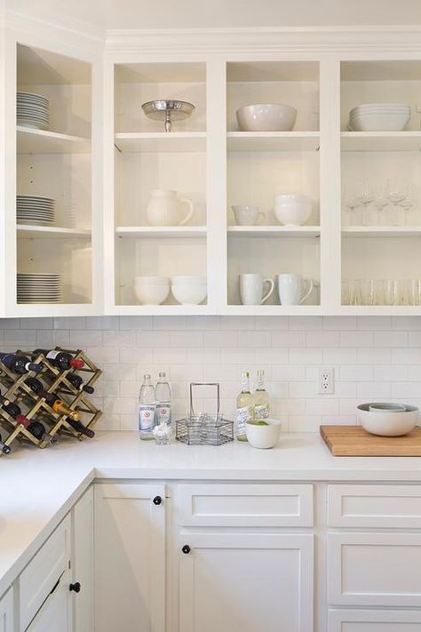 Fabulous white kitchen features upper cabinets, with no doors, used as display shelves filled with white pottery. Kitchen Cabinets With No Doors, Cabinets No Doors, Open Kitchen Cabinets No Doors, Kitchen Cabinets Without Doors, Cabinets Without Doors, New Kitchen Cabinet Doors, White Kitchen Cabinet Doors, Open Kitchen Cabinets, No Upper Cabinets