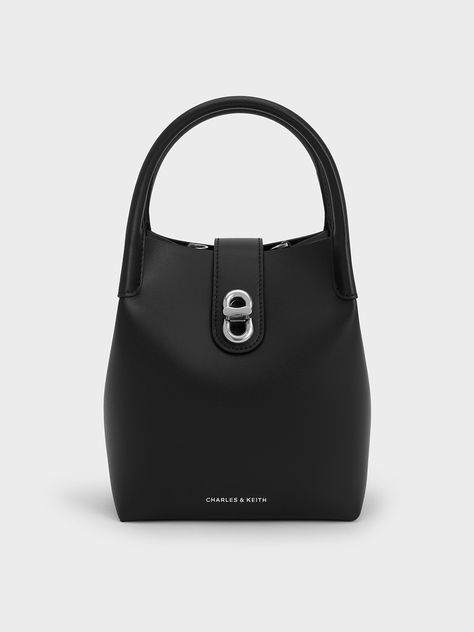 This product is made with at least 20% sustainable materials by weight. CHARLES & KEITH uses recycled, degradable, organic, and water-based materials in our eco-conscious collection.For the minimalists, the Aubrielle bag is the perfect everyday bag. The clean, unembellished exterior lets the structured silhouette stand out, especially when it comes in sleek inky black. For a contrasting element, the silver-toned turn-lock closure adds just a touch of shine. With its capacious interior and stylis The Minimalists, Ikat Pinggang, Brand Collaboration, Size Chart For Kids, Charts For Kids, Buckled Heels, Consumer Protection, Marc Jacobs Bag, Charles Keith