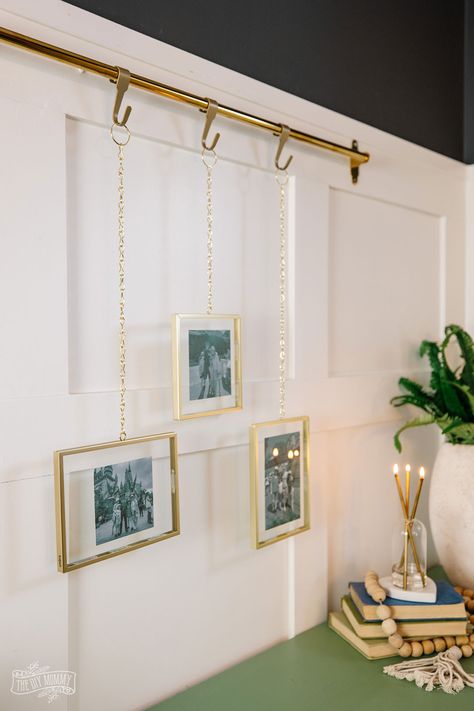 Hang Art From Ceiling, Modern Picture Rail Ideas, Art Rail Display, Hanging Picture Frame Rail Diy, Picture Rod Hanging, Hanging Unframed Art, Hanging Degrees In Office, Diy Art Hanging System, Chain Picture Hanging