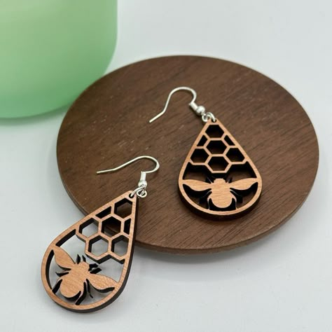 These Fun Bee Honeycomb Earrings Are Handmade Here In Our Shop At Gemini Creative. Laser Cut From Cherrywood And Paired With 925 Sterling Silver Findings. Wood Teardrop Measures Approximately 1 1/2”. Bundle Any 5 Pairs Of Gemini Creative Earrings And Receive 25% Off. Just Bundle And Offer, I Will Accept. Message Me If You Would Like Multiples Of The Same Earring And I’ll Make You A Custom Bundle. Laser Cut Jewelry Wood, Honeycomb Earrings, Earrings Wood, Laser Jewelry, Laser Earrings, Glowforge Earrings, Acrylic Earrings Laser Cut, Lazer Cut Wood, Laser Cut Bracelet