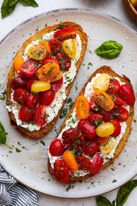 Vibrant Tomato Toast has sweet, juicy tomatoes, garlic, creamy ricotta, and fresh basil layered on a crusty slice of toasted bread. It’s delicious and savory with hints of sweetness. Serve it for breakfast, brunch, as an appetizer, or light lunch for the perfect way to use up summer produce. Tomato On Toast Breakfast, Savory Ricotta Toast, Ricotta And Tomato Toast, Basil Breakfast Recipes, Tomato Breakfast Ideas, Tomato Snack Ideas, Savory Toast Ideas, Ricotta Cheese Toast, Tomato Basil Sandwich