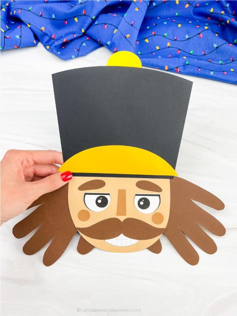 "Christmas is such a special time of year, and one way to cherish each moment is to do simple crafts with your kids. This nutcracker handprint craft is sure to put a smile on their faces as they trace their hands to make the beard for the nutcracker. They will also be able to show off their artwork when finished. The best part is that this craft is easy and inexpensive, so you can make as many as you want. So get out the supplies and let your kids have fun creating their own nutcracker Nutcracker Handprint, Diy Christmas Activities, Nutcracker Crafts, Christmas Handprint Crafts, Museum Ideas, Christmas Books For Kids, Headband Crafts, Reindeer Craft, Name Crafts