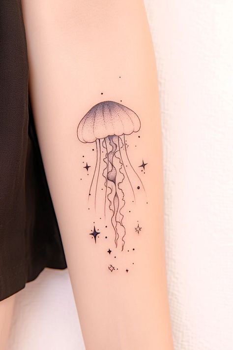 176 Unique & Enchanting Jellyfish Tattoo Designs That Stand Out – Refined Aesthetique Cartoon Jellyfish Tattoo, Cute Jellyfish Tattoo, Tattoo Ideas Jellyfish, Moon Jellyfish Tattoo, Aquarium Tattoo, Small Jellyfish Tattoo, Simple Jellyfish Tattoo, Jelly Tattoo, Sea Inspired Tattoos