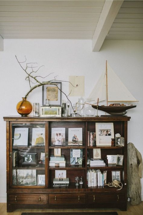 Orange Bookcase, Branches Vase, Nautical Home Decorating, Vase Orange, Decor Studio, Glass Cabinet Doors, Nautical Home, A Living Room, Book Shelf