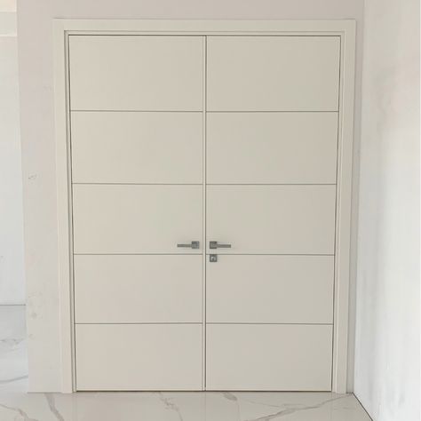 Double white doors are sober pieces that perfectly integrate modern spaces, creating an elegant atmosphere. Double door - Flat panel - Matte White Finish. For more information, contact us at info@italdoors.com or visit the Miami showroom. White Doors, Double Door, Modern Spaces, Double Doors, Armoire, Showroom, Miami, Doors, Furniture