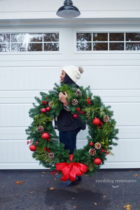 classic christmas decorations, colonial house with wreaths on windows, wreaths on exterior windows, wreath on chimney, large exterior wreath Large Wreath Outdoor, Giant Christmas Wreath, Exterior Christmas Decorations, Outdoor Christmas Wreaths, Large Christmas Wreath, Classic Christmas Decorations, Christmas Window Decorations, Christmas Decorations Wreaths, Christmas Decor Inspiration