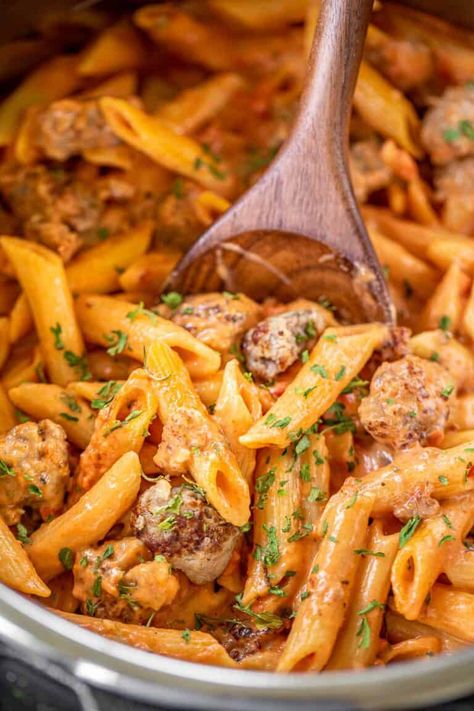 Instant Pot Penne a la Vodka with Italian Sausage - inspired by our favorite Italian restaurant. SUPER easy to make with only a 4 minute cook time. This pasta tastes just as good (if not better) than the restaurant! Italian sausage, garlic, red pepper flakes, crushed tomatoes, chicken broth, onion, penne pasta, and heavy cream. All you need is a salad and some garlic bread for a restaurant-quality meal! #instantpot #pressurecooker #pasta #italian #sausage #vodka Vodka Spaghetti, Best Penne Alla Vodka Recipe, Vodka Penne Pasta, Pasta Italian Sausage, Red Pepper Pasta Sauce, Sausage Penne, Penne Vodka, Vodka Sauce Recipe, Vodka Sauce Pasta