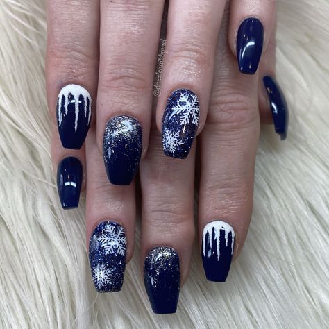 Beautiful navy blue gel polish with glitter nail and snowflakes with icicles. Perfect set for the winter time! Winter Nails After Christmas, Blue Glitter Snowflake Nails, Navy Blue Xmas Nails, Navy Blue Christmas Nails Winter, Blue Christmas Nails Winter Sparkle, Navy Blue Snowflake Nails, Holiday Nails Blue And Silver, Nails Snowflakes Blue, Navy Snowflake Nails