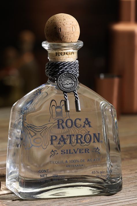 Roca Patrón Silver is handcrafted from the finest 100% Weber Blue Agave at Hacienda Patrón distillery in Jalisco, Mexico. The agave is baked in small brick ovens for 79 hours and is then pressed by a two-ton volcanic stone tahona wheel. Tequila Bottle Aesthetic, Expensive Drinks, Tequila Distillery, Lime Tea, Patron Silver, Tequila 1800, Brick Ovens, Ig Video, Tequila Bottle