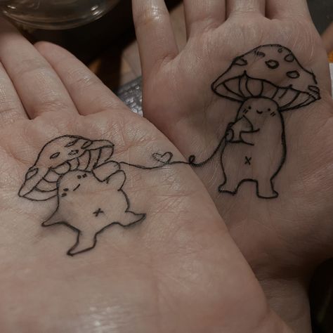 tiny mushroom matching matching tattoo cute mushroom mushroomdrawing Matching Mushrooms Tattoo, Matching Cottagecore Tattoos, Mushroom Best Friend Tattoo, Best Friend Mushroom Tattoo, Walking Mushroom Tattoo, Mushroom People Tattoo, Mini Mushroom Tattoo, Matching Mushroom Tattoos, Autumn Tattoos