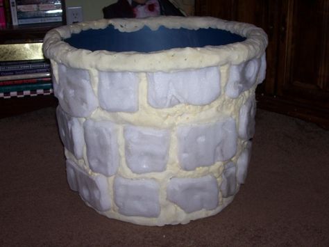 ... I decided to work on a faux well for a Samara/The Ring static prop for '08. I used a large round storage container from Wal-Mart as the supporting structure, I made the stones from styrofoam and filled in the gaps with great stuff and carved it down. Here's what I have so far...I still have to add a layer of monster mud, paint the stones and build the armature for Samara. Halloween Well Prop, Great Stuff Foam Projects, Samara The Ring, Foam Projects, Egypt Vbs, Monster Mud, Weird Animals Vbs, Mud Paint, Larp Props