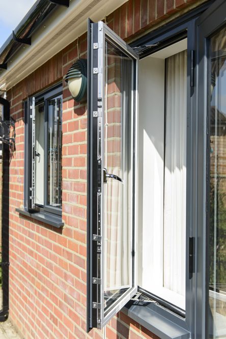 Open casement window finished in Anthracite Grey on the outside and white on the inside Grey Windows Inside, Composite Front Doors Uk, Anthracite Grey Windows, Front Doors Uk, Modern Farmhouse Ideas, Sliding Doors Exterior, Exterior Door Colors, Grey Windows, Aluminium Windows And Doors