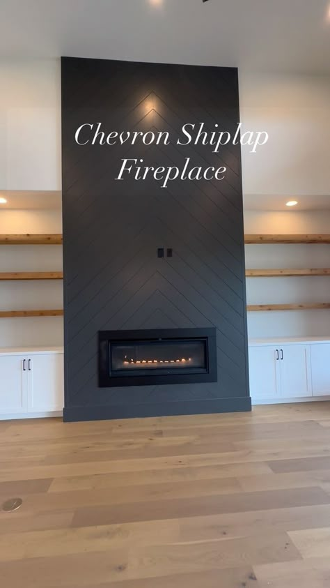 This floor to ceiling chevron pattern shiplap makes this fireplace such a beautiful focal point in this modern farmhouse living room. #princeconstruction #customhome #customhomes #fireplace #shiplapfireplace #chevronpattern #blackfireplace #ironore #gasfireplace #boernehomes #homesofinstagram #homesofinsta #buildersofig #customhomebuilder #texasbuilders #texaahomes #boerne #boernetx #boernetexas #sabinascreekranch | Prince Construction | oldiesforlife__ · Original audio Fireplace Feature Wall Ideas Shiplap, Floor To Ceiling Fireplace Shiplap, Black Herringbone Shiplap Fireplace, Herringbone Backsplash Fireplace, Black And Wood Fireplace Wall, Herringbone Tile Fireplace Wall, White Vertical Shiplap Fireplace, Black Shiplap Fireplace With Built Ins, 2025 Fireplace Trends