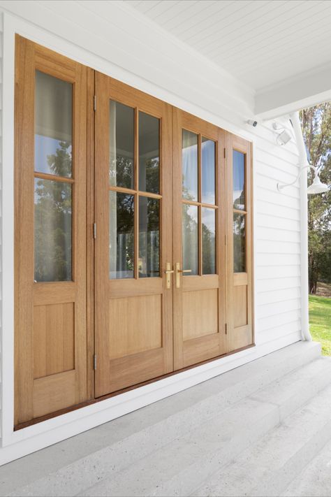 The Tradco Menton Lever in Satin Brass complements the double timber doors beautifully, adding a touch of contemporary elegance to their design. Together, they create a cohesive and stylish entrance that enhances the overall aesthetic of the space. Timber Front Door Entrance, Double Door Design Entrance, Wood Double Front Door, Double Front Door Ideas, Double Wood Front Doors, Timber Front Door, Double Front Entry Doors, Wood Fence Design, Double Doors Exterior