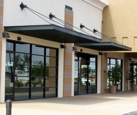 Contemporary storefront awnings | Exterior Trim: Arbors, Pergolas ... Window Awnings Exterior Metal, Awning Canopy Ideas, Commercial Awning Ideas, Black Metal Awning, Modern Store Fronts, Restaurant Awning, Steel Awning, Commercial Awning, Awning Brackets