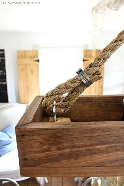 A DIY tutorial to make a rustic farmhouse style hanging light fixture using wood boards and prewired light kits, no electrical skills necessary! Diy Hanging Light Fixtures, Rustic Lighting Diy, Rustic Cottage Interiors, Outdoor Kitchen Lighting, Diy Hanging Light, Rope Clamp, Rustic Furniture Diy, Wood Light Fixture, Rustic Farmhouse Living Room