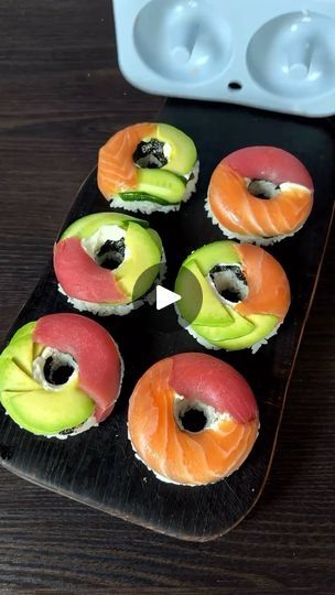 1.3K reactions · 260 shares | Sushi Donuts 🌟😍 
 
Ingredients: 
🍣Lightly salted salmon/trout 
🍣Tuna 
🍣Avocado 
🍣Cucumber 
🍣Cream cheese 
🍣Nori chips 
🍚Boiled rice (200 g. raw) 
🍚Rice vinegar: 40 ml. 
🍚Salt: 1/2 tsp. 
🍚Sugar: 1 tsp. 
Preparation: 
🍣Mix the boiled rice with rice vinegar, salt and sugar, let it cool, stirring occasionally. 
🍣In a donut mold, place the salmon, avocado, tuna and cucumber, then place the cheese and nori chips, and top with the rice. Then flip the mold, dip in soy sauce and enjoy ☺️ Bon appétit!!  
 
( By: @chef_dmitriy_official ) 🫶🏻 Thank you  
 
. 
. 
. 
. 
#easyrecipe #lunchidea #dinneridea #recipeinspiration #sushirecipe #sushi #easyssushi #sushibdonuts #sushihomemade #seafood #salmon #tuna | Goodies Channel Sushi Donut Recipe, Sushi Birthday Party Ideas, Tuna And Cucumber, Nori Chips, Sushi Donut, Sushi Cakes, Salted Salmon, Sushi Birthday, Sweet Sushi