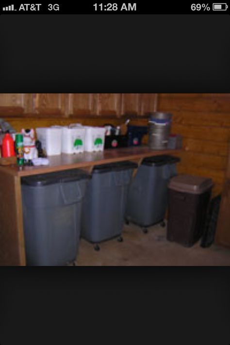 Table over feed bins. I like that the bins are on wheels Tackroom Storage, Tackroom Ideas, Horse Feed Room, Tack Room Organization, Feed Room, Horse Shed, Horse Tack Rooms, Barn Hacks, Diy Horse Barn