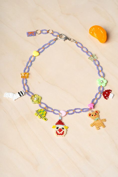 The Accessories – Pon The Store Seed Bead Charm Necklace, Tri Beads Crafts Projects, Beaded Charm Necklace, Things To Make With Beads, Bead Necklace Patterns, Beaded Miniatures, Clown Necklace, Beading Basics, Beaded Objects