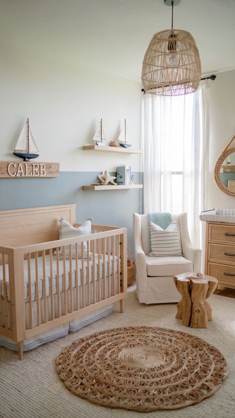 A nautical-themed nursery with light wood furniture, sailboat decor, and calming blue and white accents.