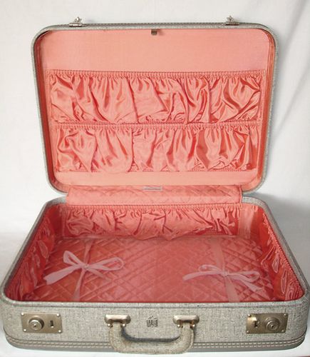 I have one of my parents' suitcases from the late 50's.  The exterior is cream with brown trim and the interior is a deep red satin.  It is so much like this one, only it has one row of gathered pockets on the lid and the same bottom without the ribbons.  I have always cherished it. Travel Guide London, Old Suitcases, Vintage Suitcases, Nate Berkus, Vintage Suitcase, Vintage Luggage, Profile On Instagram, The Good Old Days, Vintage Travel Posters