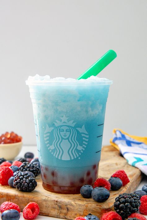 This easy-to-make Starbucks Summer Skies Drink copycat takes the Summer-Berry Refresher base and mixes it with coconut milk and raspberry pearls. Starbucks Summer Skies Drink Copycat, Summer Skies Drink, Summer Skies Starbucks Recipe, Summer Skies Drink Starbucks, Summer Skies Starbucks, Drinks You Can Make At Home, Starbucks Summer Skies Drink, Starbucks Boba Drinks, Starbucks Summer Berry Refresher