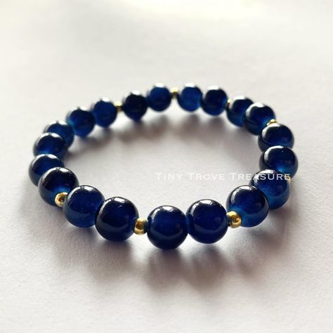 The Midnight Blueberry Bracelet… Blue Stretch Glass Bracelet- Classic Glass Round Bracelet 8mm - Unisex, Blue, Glass Bracelet Experience timeless elegance with our meticulously crafted Classic Blue Glass Bracelet, boasting captivating shades reminiscent of tranquil ocean waves. Elevate your style effortlessly with this exquisite accessory. - Classic Blue Glass Beaded Bracelet - Crafted with 8mm glass beads - Elastic design for comfort and style - Expresses unique personality effortlessly ... Blueberry Bracelet, Round Bracelet, Glass Beaded Bracelet, Bracelet Blue, Glass Bracelet, The Midnight, Glass Beaded Bracelets, Bracelet Crafts, Classic Blue