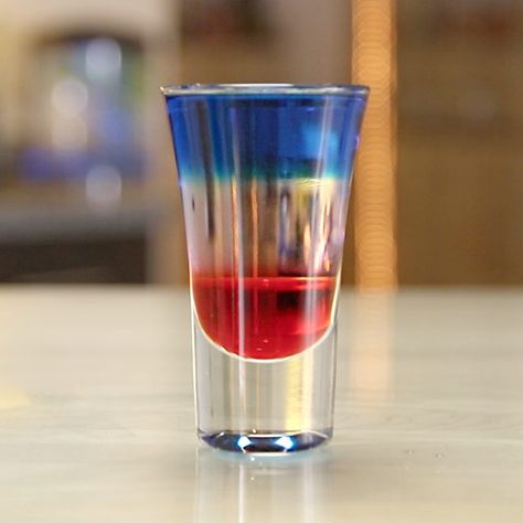 Everybody knows the colors red, white, and blue never run — that is unless they're running together in these sweet little 4th of July Layered Shots. With a combination of Blue Curaçao, White Creme De Cacao, and grenadine, these shots are guaranteed to please any and all upstanding (or totally relaxed) citizens. Disaronno Drinks Recipes, Henny Colada, Strawberry Cocktail Recipe, Tipsy Tuesday, Layered Shots, Drink Image, Shooter Recipes, Candy Cocktails, Cocktail Shots