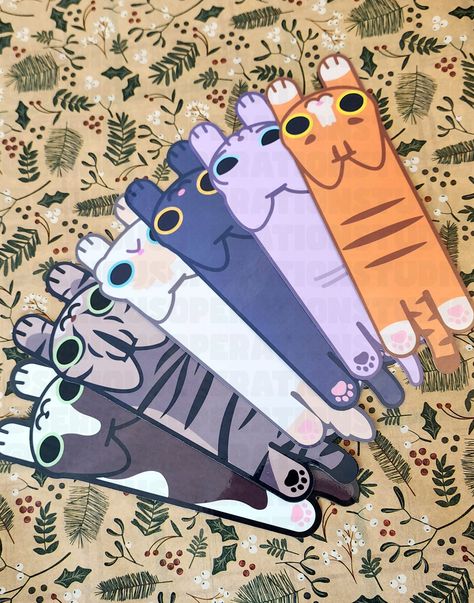 This listing is for ONE long cat OR dog bookmark. We've got a couple of designs so feel free to ask any questions you need. We offer different eye colors (for both cats and dogs) and coat colors (for dogs) if you don't see one that you're looking for, message us!  Product details: Each bookmark is approximately 2x7. They are laminated on a gloss finish paper. As these are handmade please allow for a small margin of error.