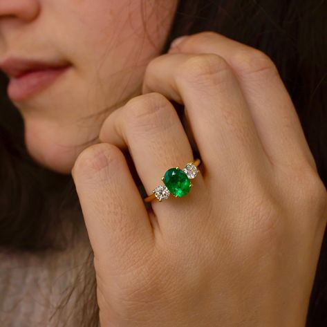 ROHINI Although the meaning of a three stone ring is often poetically connected with the three chapters of our lives, past, present and future, stones like emeralds have their own stories and can signify much, much more. The Rohini is a very pretty floral inspired trilogy ring and features two round cut side diamonds. Because of its rounded sides it suits shapes like Ovals, Rounds and Asscher cuts. It can be set with your choice of centre stone and metal choice. Oval cut Green Emerald 1.40... Asscher Ring, Oval Emerald Ring, Trilogy Ring, Three Stone Ring, Asscher Cut, Three Stone Rings, Green Emerald, The Meaning, Emerald Ring