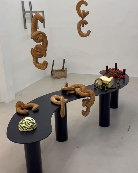 Hannah Kleeberg on Instagram: "Italian Aperitivo meets German Brotzeit 🌀 For the launch of the new interior brand @bottone_objects we curated a food installation that narrates the intersection and clash of the produce and food culture of those two countries. And we had a blast - and in typical herrlich manner created Kilogramms of (vegan) butter, flying ciabatta and wavy pickles. Creative direction: @herrlich.dining @hooliganhanni Fellow Food Stylists: @ohamyjaeger @_liserr_ Location: @voostore Bread: @theclumsy_eater Special thanks to: @haus.otto Pickle fun inspired by: @sabatoamsterdam All the love from Hannah & the herrlich family 🌀" Food Installation Art, Hanging Food Display, Food Art Installation, Food Installation, Spring Feast, Butter Flying, Food Exhibition, Italian Aperitivo, Nye Dinner