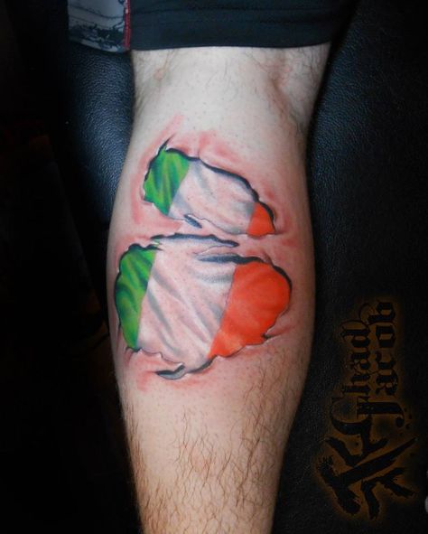 Irish flag skin rip by Chad Jacob. Follow him on Instagram: @CJTATTOOS or Facebook: Chad Jacob Tattoos Irish Flag Tattoo, Flag Tattoos For Men, Skin Tear Tattoo, Leprechaun Tattoos, Rip Tattoos For Dad, Ripped Skin Tattoo, Celtic Tattoos For Men, Flag Tattoos, Rip Tattoo