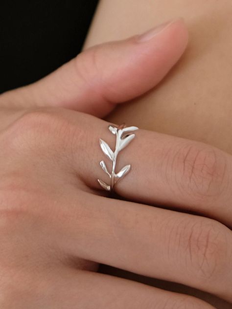 This nature-inspired statement ring features an elegant leaf design plated in lustrous gold, creating an organic yet sophisticated aesthetic. The delicate veining and curved silhouette of the leaf captures the essence of natural beauty while adding a touch of botanical charm to any ensemble. Perfect for the nature lover, this versatile piece works seamlessly from day to evening wear, making it an essential addition to your jewelry collection.Color: silver, gold Sophisticated Aesthetic, Leaf Ring, The Leaf, Women Accessories Jewelry, Leaf Design, Statement Ring, Nature Lover, Evening Wear, Nature Inspired