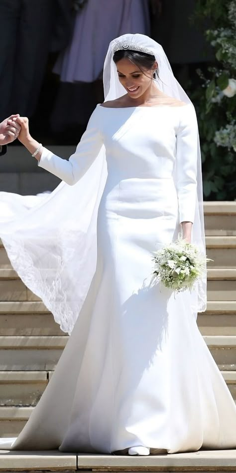 Meghan Markle’s wedding dress differed from Queen Letizia’s, but there was a special detail connecting both designs. Find all the details in the article! 📄 Givenchy Wedding Dress, Meghan Markle Dress, Harry And Meghan Wedding, Meghan Markle Wedding Dress, Celebrity Wedding Photos, Royal Wedding Gowns, Meghan Markle Wedding, Second Wedding Dresses, Princess Meghan