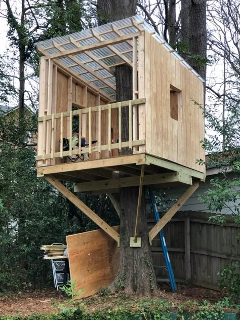 Have a few things to finish but she’s basically all ready to go - treehouse Tree House One Tree, She Shed Tree House, Modern Treehouse Kids, Modern Treehouse Ideas, Tree House Ideas Inside, Treehouse Roof Ideas, Single Tree Treehouse, Tree House Designs Simple, Diy Treehouse For Kids