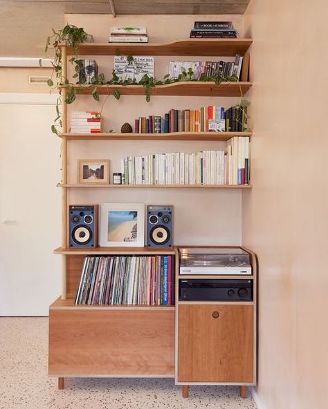 Lozi on Instagram: "The first custom piece Soroush designed for his space 🎵  Tucked in the corner of their dining area, our founder Soroush and his wife Barbara needed a shelving unit to house films, books, a record player and vinyl collection. (And occasionally their cat Sučuk too!)  Keen to make use of the room’s height rather than take up precious floor space, our designs played with depth, based on the differing sizes of each object that would sit on the shelves.   This concept removes the bulk from the piece of furniture, working with the space (and each specific object) rather than against it.  Our favourite hidden detail has to be the plug socket and cable tidy tucked away within the cupboard.  See the full project via the link in our bio 🔗  #vinylrecords #vinylcollection #vinylco Vinyl Shelf, Cable Tidy, Vinyl Collection, Big Windows, In The Corner, Clever Storage Solutions, Plywood Furniture, Corner Unit, Plug Socket