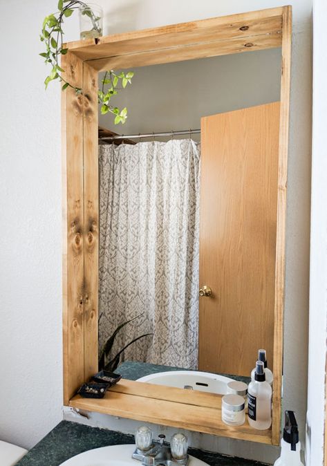 Bring some added character to your bathroom with a DIY bathroom mirror makeover. This easy tutorial guides you in adding a rustic DIY wooden bathroom mirror frame. Diy Bathroom Mirror Makeover, Diy Bathroom Mirror, Wooden Bathroom Mirror, Bathroom Renovation Diy, Bathroom Mirror Makeover, Bathroom Mirrors Diy, Architecture Renovation, Diy Bathroom Makeover, Bathroom Mirror Frame