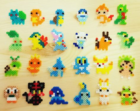 Hand made tiny perler pokemon charms Perler Beads Charms, Tiny Hama Bead Designs, Small Pokemon Perler Bead Patterns, Perler Pokemon Pattern, Pixel Perler Beads, Peeler Bead Pokémon, Pokemon Aquabeads, Perler Bead Patterns Small Easy Pokemon, Cute Tiny Perler Bead Patterns