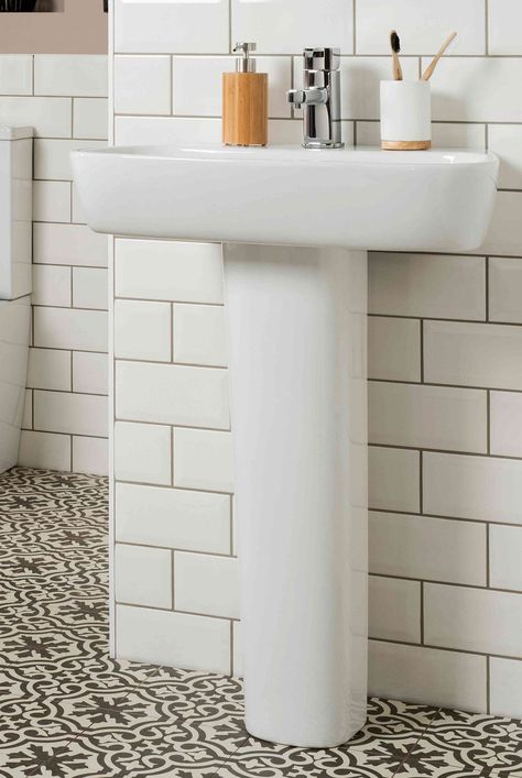 Get inspiration for adding practical storage to your pedestal sink while infusing your bathroom with function and style. #bathroomstorageideas #declutter #declutterideas #homeorganization #howtoclean #organizationtips #thespruce Small Bathrooms With Pedestal Sinks, Pedistool Sink Storage Bathroom Ideas, Half Bathroom Ideas With Pedestal Sink, Pedastool Sink, Under Pedestal Sink Storage, Pedestal Sink Storage Ideas, Pedastal Sink, Pedestal Sink Ideas, Pedestal Sink Powder Room