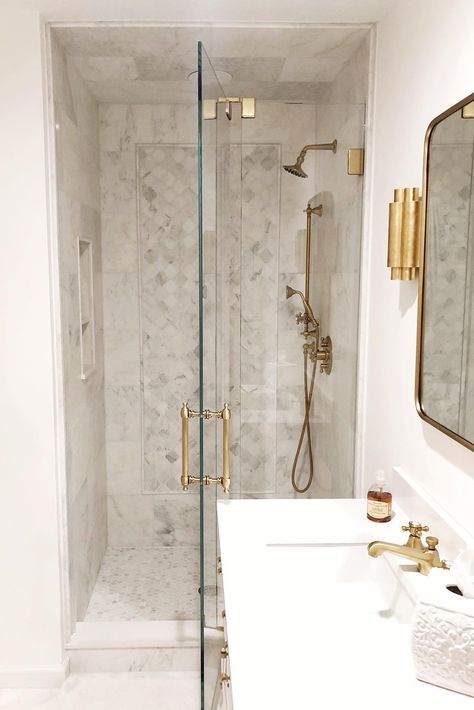 Satin Brass faucet and shower add a timeless touch to a bathroom. Design inspiration featuring Del Mar Series 📷 @thegrayunknown