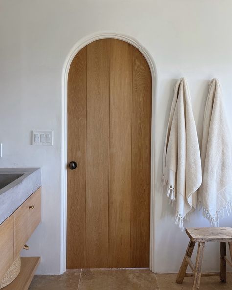 White oak, paneled, arched doors: a designer’s dream, and a GC’s nightmare 😂 #whiteoak #whiteoakdoors #archeddoor #archeddoorway #bathroomtile #bathroomidea Arch Door Bathroom, Arch Interior Doors, White Oak Doors Interior, White Oak Interior Doors, White Panel Doors, Arched Interior Doors, Arch Trim, Arch Door, Oak Interior Doors