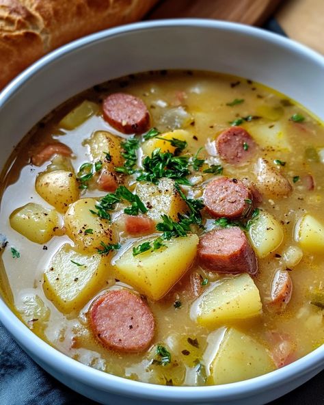 Kielbasa Potato Soup: Ingredients: - 1 pound turkey kielbasa, sliced - 5 medium potatoes, peeled and diced - 1 medium onion, chopped - 2 cloves garlic, minced - 4 cups chicken broth - 2 cups milk - 1 cup shredded cheddar cheese - 1 cup heavy cream - 2 tablespoons olive oil - 1 teaspoon smoked paprika - Salt and pepper to taste - Fresh parsley, chopped (for garnish) Instructions: 1. In a large pot, heat olive oil over medium heat. Add the sliced kielbasa and cook until browned,... Potato Pepper Soup, Potato And Chicken Soup, Kielbasa Potato Soup, Turkey Kielbasa, Kielbasa Soup, Diy Healthy Snacks, Soup Ingredients, Shredded Cheddar Cheese, Charcuterie Recipes